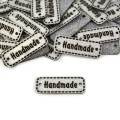 Zestaw metek ekoskóra metalizowana "Handmade" / srebro / 11 x 30 mm / 5 szt.