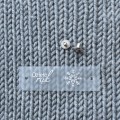 Metka silikonowa z nitem "Dzieło rąk" / śnieżka / srebro / 60 x 20 mm / 1 szt.